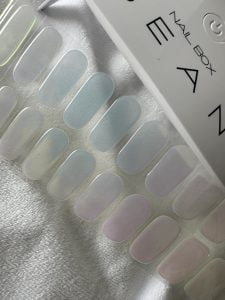Pearlescent semi cured gel nail sticker kit seen here with Bean a LED lamp sold by Nail Box